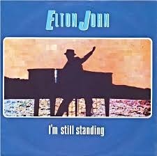 Elton John – I’m Still Standing [The Rocket Record Company]